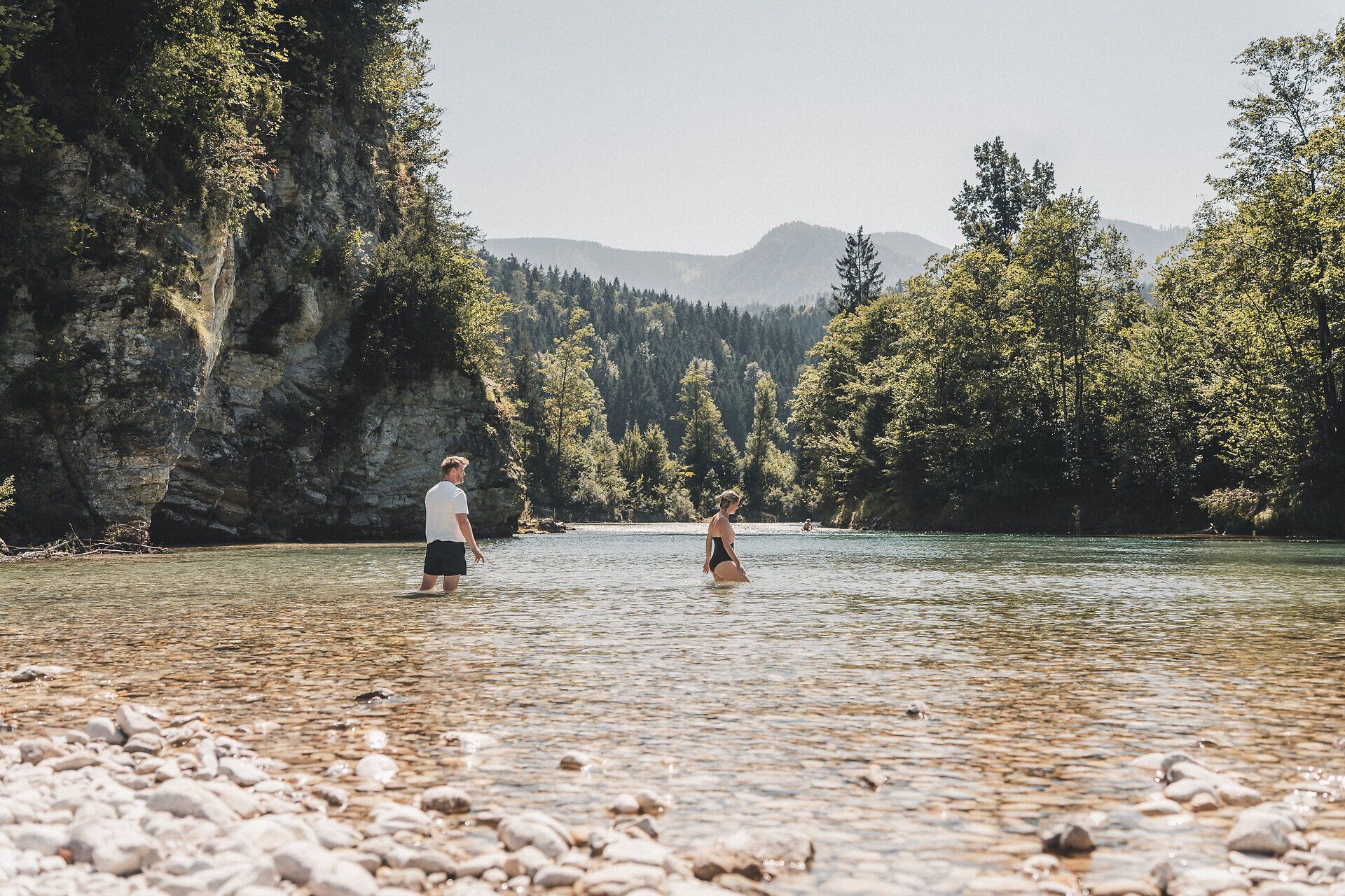 Couple wading in the river along the Ybbstal cycle path