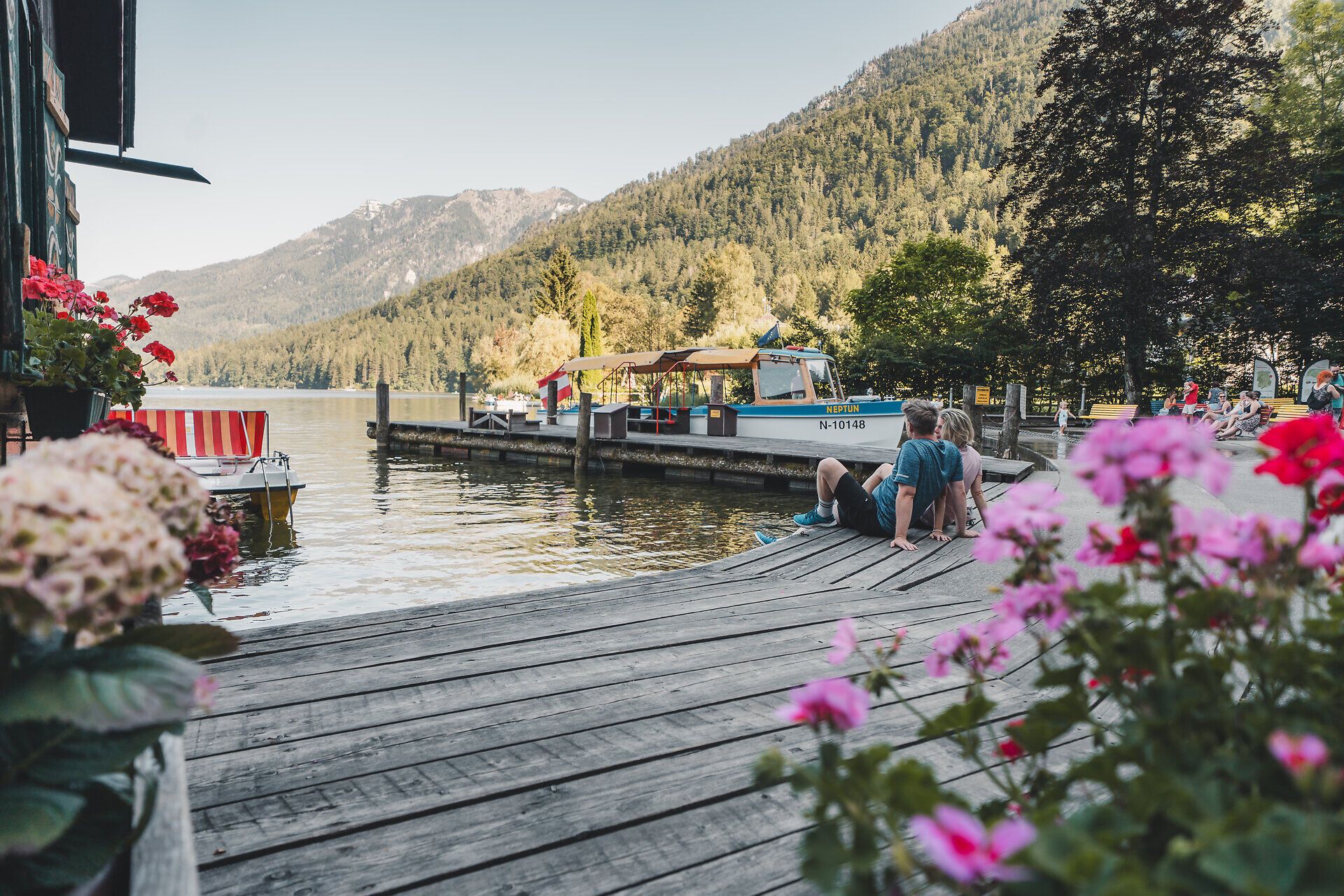 Couple relaxing on the jetty of Lake Lunz